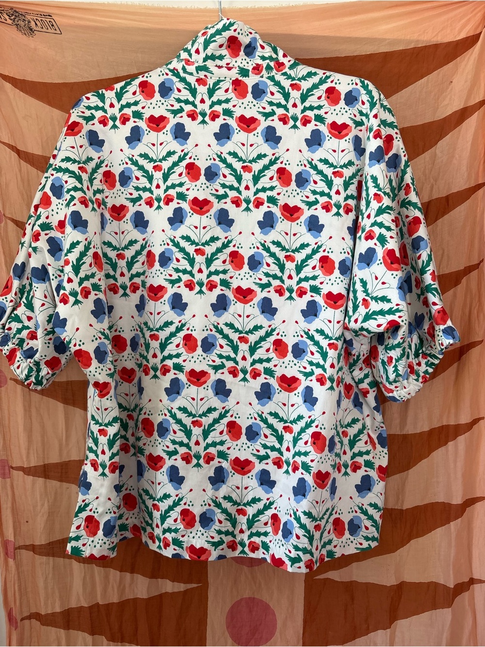 Emily McCarthy Floral Popover Blouse in White with Red & Blue Print - Picture 2 of 5